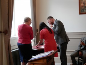 Hayley and Scott signing the Naming Day scroll